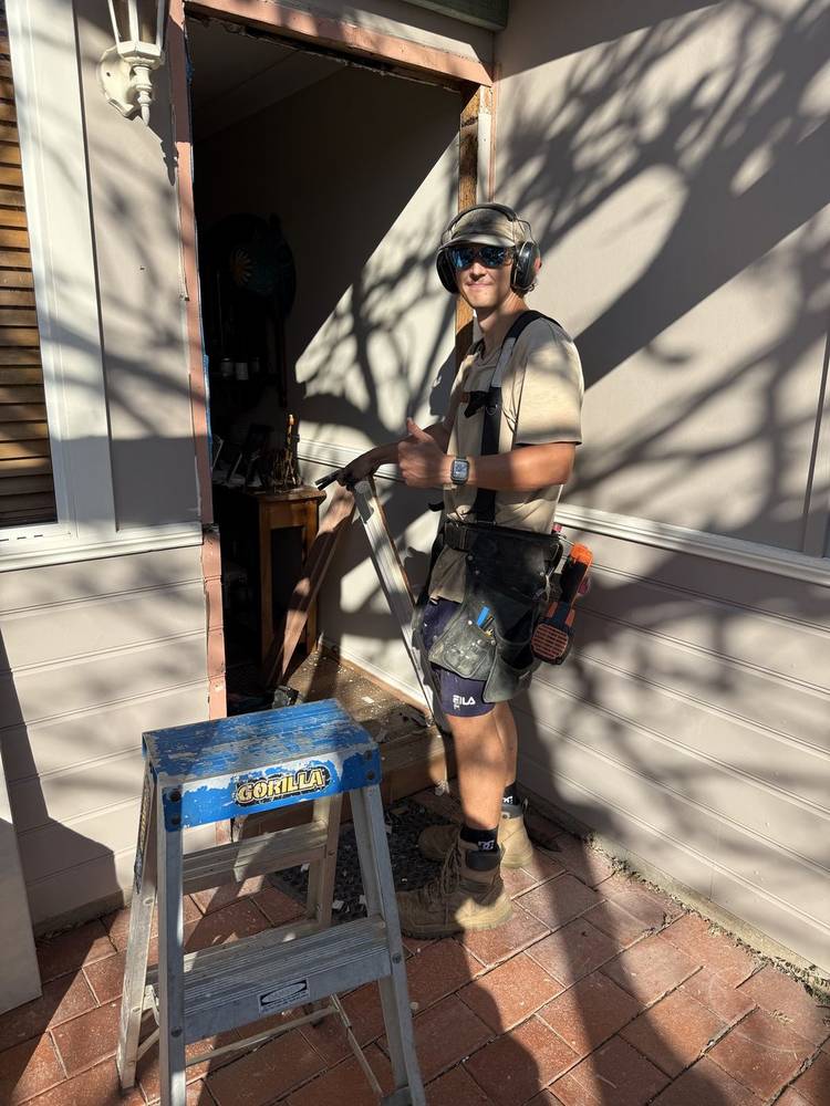 Carpenter on site with a saw