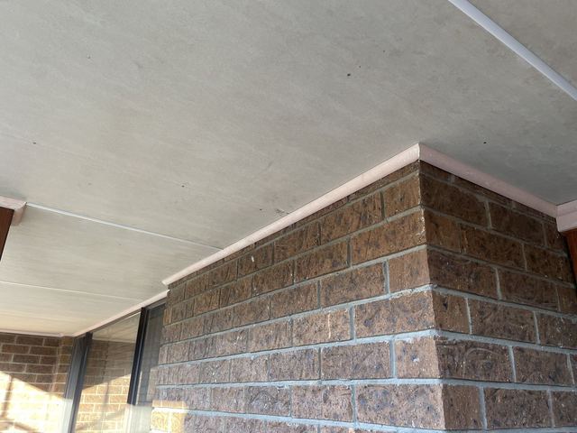 New eaves lining above a brick wall