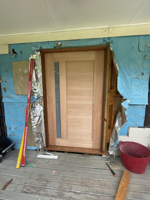 New front door and sidelight fitted square in the frame