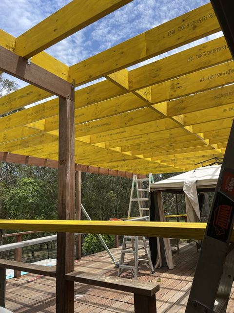 New pergola rafters fixed across the beams